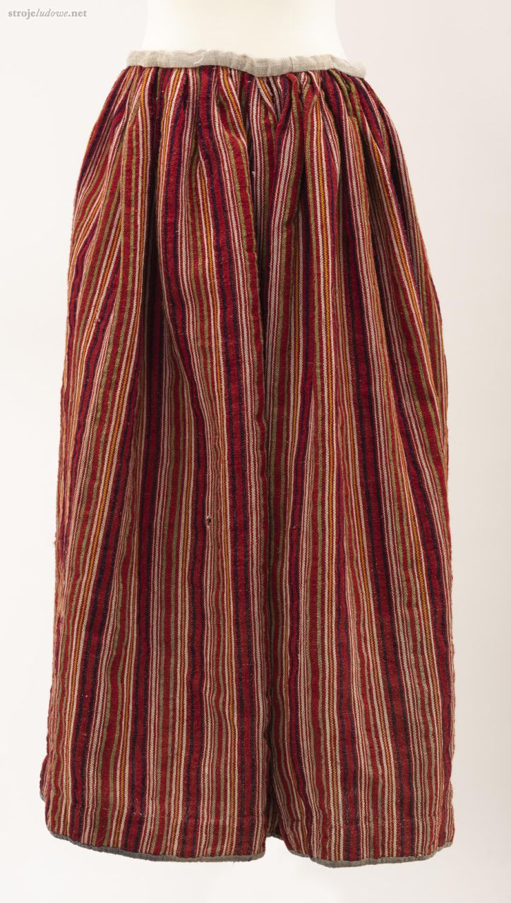 Spódnica, Roztoka, pow., chełmski 1958&nbsp;r, ze&nbsp;zbiorów Muzeum Narodowego w&nbsp;Lublinie.
Spódnica zszywana z&nbsp;czterech pasów tkaniny lniano-wełnianej, tkanej na&nbsp;warsztacie splotem prostym w&nbsp;pasy. Marszczona i&nbsp;wszyta w&nbsp;pasek z&nbsp;płótna. Dół wzmocniony pasem szarego płótna. Na&nbsp;czerwonym tle pionowe pasy w&nbsp;kolorach: zielonym i&nbsp;białym. Wiązana na&nbsp;troczki ze&nbsp;sznurka.